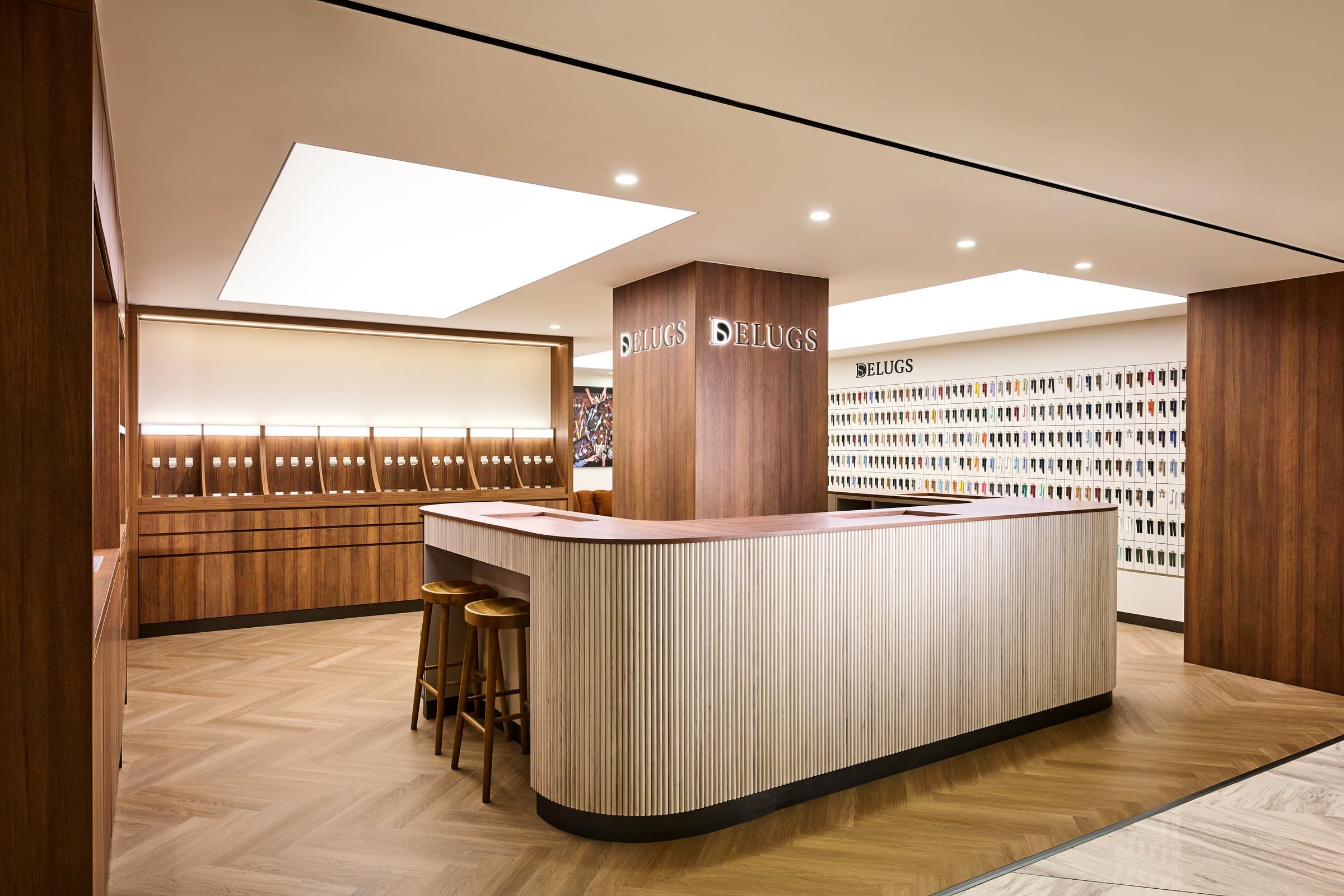 Inside the Delugs Flagship Boutique in Hong Kong — the bar counter and strap wall